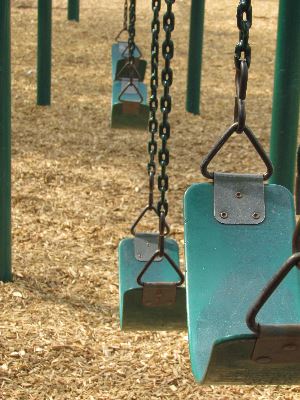 Teal swings in a park